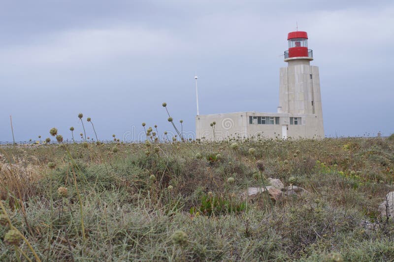 The lighthouse at Sagres Point, a windswept shelf-like promontory in the southwest Algarve region of Portugal. The lighthouse at Sagres Point, a windswept shelf-like promontory in the southwest Algarve region of Portugal.