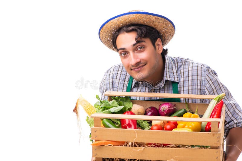 O fazendeiro novo com os produtos frescos isolados no fundo branco imagens de stock O fazendeiro novo com os produtos frescos isolados no fundo branco imagens de stock
