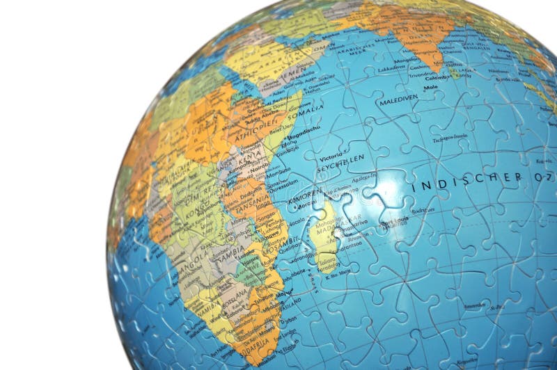 O globo do enigma no branco imagem de stock O globo do enigma no branco imagem de stock