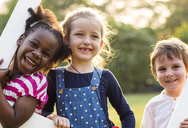 Group of kindergarten kids friends playing playground fun and smiling. Group of kindergarten kids friends playing playground fun and smiling