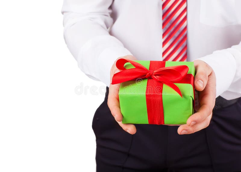 O homem de negócios guarda para fora a caixa de presente fotos de stock royalty free O homem de negócios guarda para fora a caixa de presente fotos de stock royalty free
