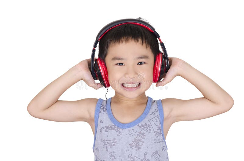 O menino bonito escuta a música foto de stock O menino bonito escuta a música foto de stock