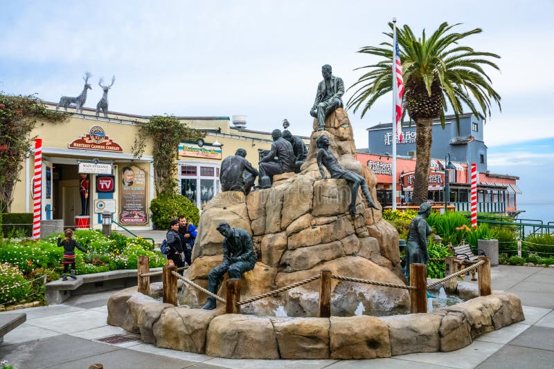 MONTEREY, CA - DEC 17, 2014: The Cannery Row Monument, a tourist attraction featuring literary Nobel Prize winner John Steinbeck, at historic 700 Cannery Row, Monterey, CA. MONTEREY, CA - DEC 17, 2014: The Cannery Row Monument, a tourist attraction featuring literary Nobel Prize winner John Steinbeck, at historic 700 Cannery Row, Monterey, CA.