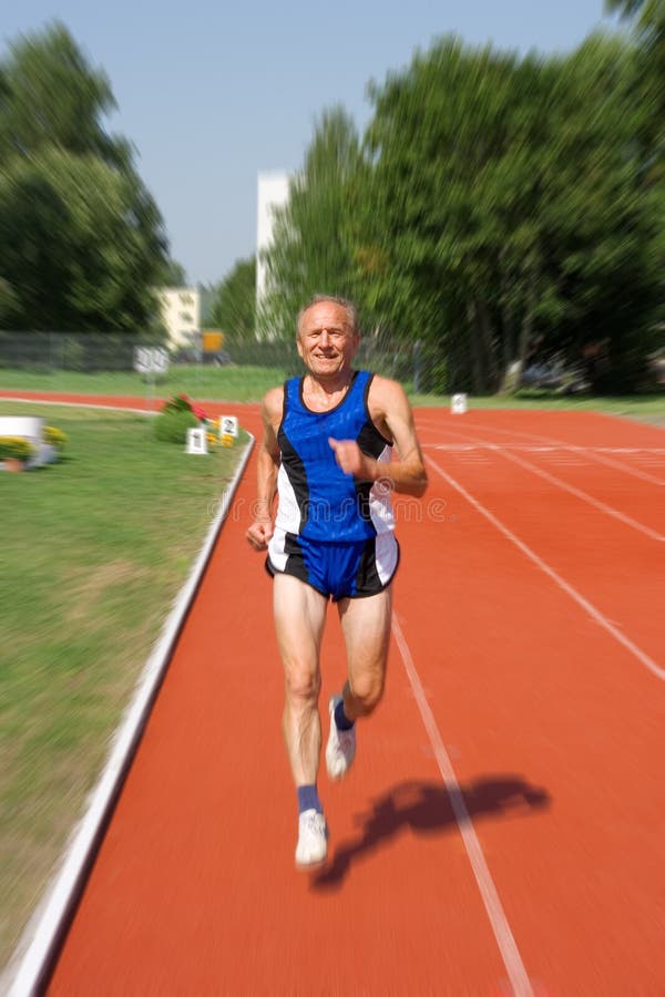 Senior runner in a stadium. Motion effect. Senior runner in a stadium. Motion effect