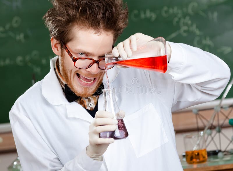 Crazy scientist mixes two liquids in his laboratory. Crazy scientist mixes two liquids in his laboratory