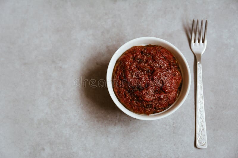 Healthy vegan beetroot muffin in white cup and vintage fork on rustic grey board. Festive composition, copy space available. Flat lay. Film style. Healthy vegan beetroot muffin in white cup and vintage fork on rustic grey board. Festive composition, copy space available. Flat lay. Film style.