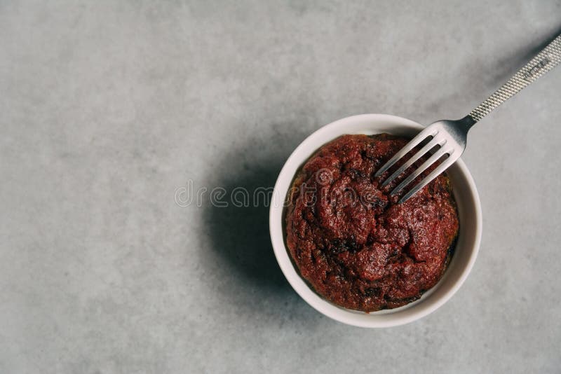 Healthy vegan beetroot muffin in white cup and vintage fork on rustic grey board. Festive composition, copy space available. Flat lay. Film style. Healthy vegan beetroot muffin in white cup and vintage fork on rustic grey board. Festive composition, copy space available. Flat lay. Film style.