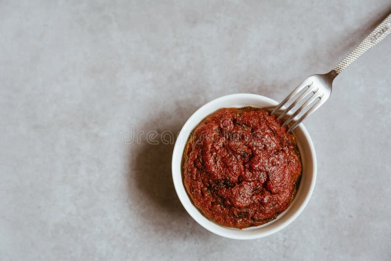 Healthy vegan beetroot muffin in white cup and vintage fork on rustic grey board. Festive composition, copy space available. Flat lay. Film style. Healthy vegan beetroot muffin in white cup and vintage fork on rustic grey board. Festive composition, copy space available. Flat lay. Film style.