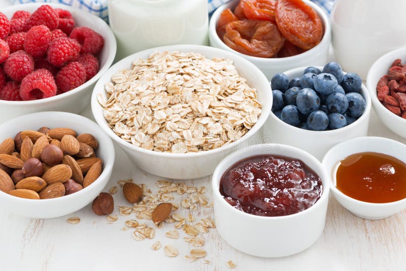 Oat flakes and various ingredients for breakfast, close-up