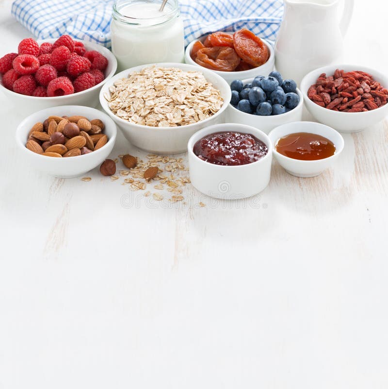 Oat flakes, various ingredients for breakfast and place for text