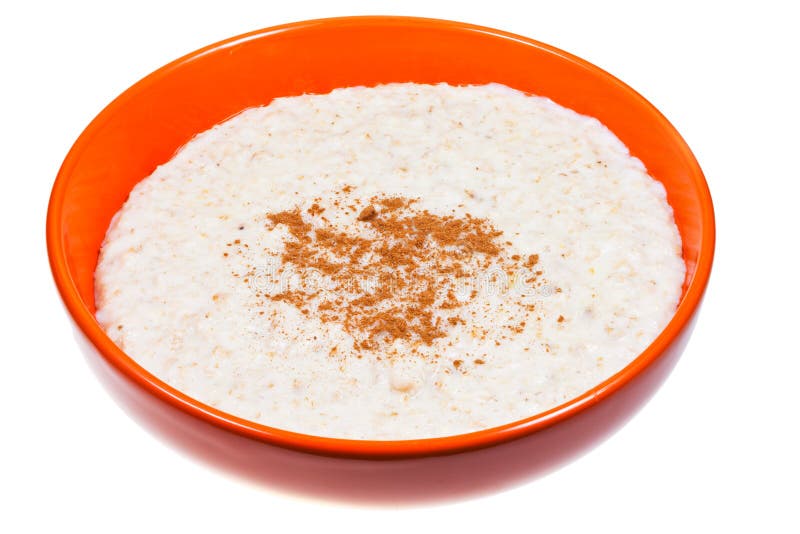 Oat porridge with cinnamon in orange bow royalty free stock image