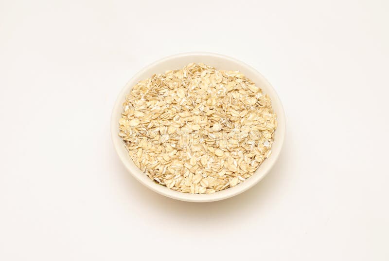 Oatmeal and measuring cup stock photo. Image of food 10910792
