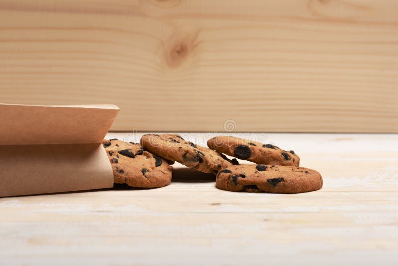 Oatmeal chocolate cookies on vintage background stock photos Oatmeal chocolate cookies on vintage background stock photos