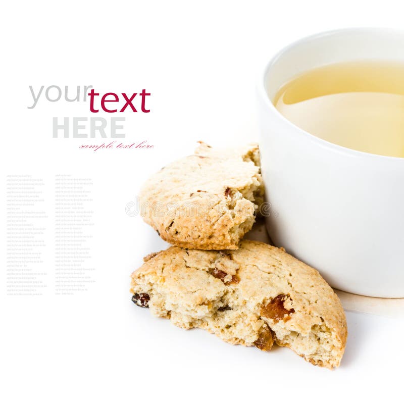 Oatmeal cookie with raisins and cup of green tea on white backg