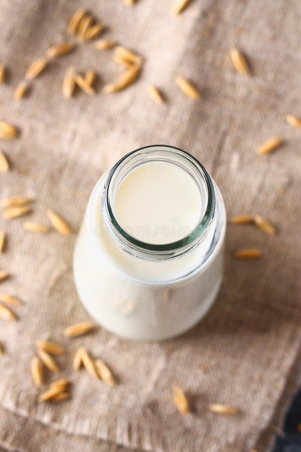 Oatmeal in a Glass Bottle. Oat Grain and Cereal in Jars. Stock Photo Image of dietary, bran