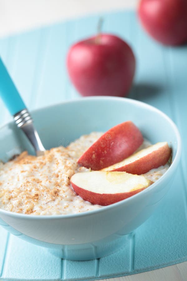 Oatmeal porridge with apple stock images