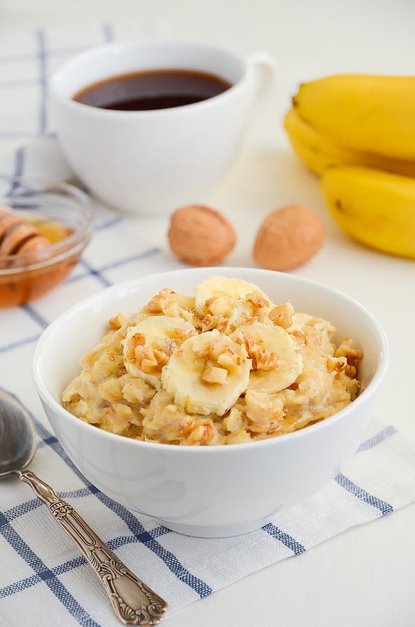 Oatmeal porridge with banana, honey and walnuts royalty free stock photo Oatmeal porridge with banana, honey and walnuts royalty free stock photo