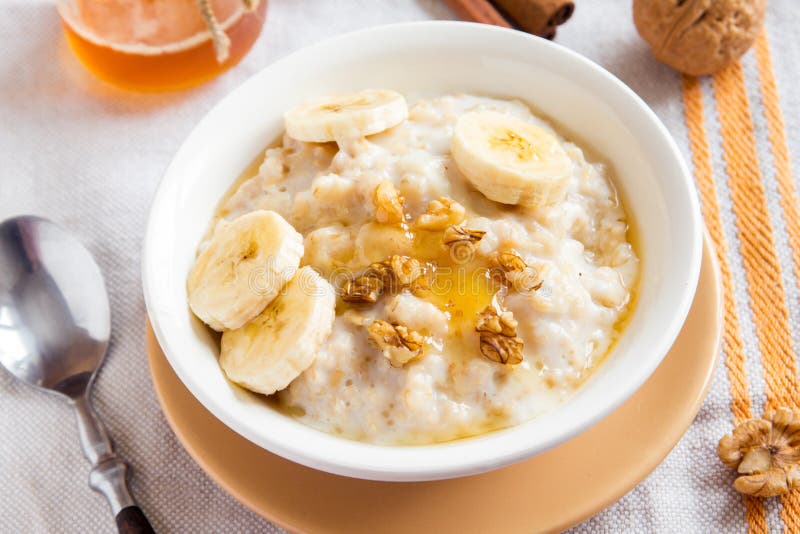 Oatmeal Porridge with Banana, Nuts and Honey Stock Image - Image of ...