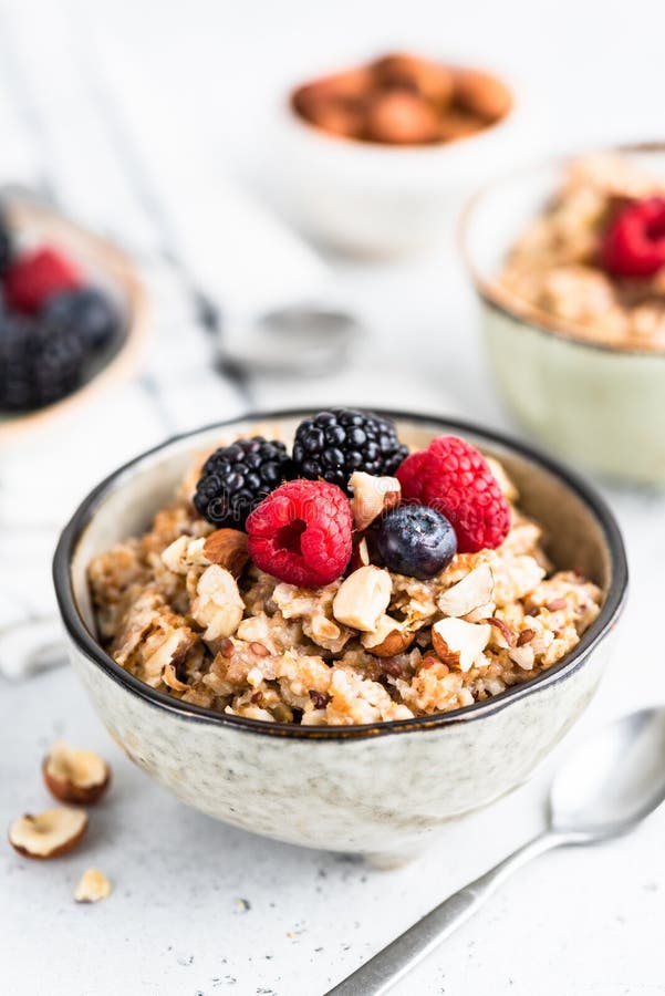 Oatmeal Porridge with Berries, Seeds and Nuts Stock Photo - Image of ...