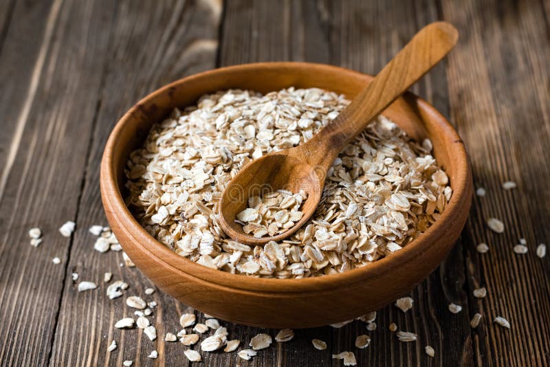 Oatmeal. Uncooked oatmeal on the table royalty free stock photos