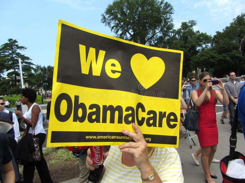 Photo of supporter of obamacare at the supreme court in washington dc on 6/28/12. The supreme court upheld president obama's health care plan allowing an additional 33 million people in the united states to be covered by health insurance. Preexisting conditions and discrimination based on age or gender are no longer allowed. Opponents of the law do not like the fine that can be imposed on those who do not have health insurance coverage. Other objections are rationing of medical care as well as possible lowering of standards to allow more people access. Photo of supporter of obamacare at the supreme court in washington dc on 6/28/12. The supreme court upheld president obama's health care plan allowing an additional 33 million people in the united states to be covered by health insurance. Preexisting conditions and discrimination based on age or gender are no longer allowed. Opponents of the law do not like the fine that can be imposed on those who do not have health insurance coverage. Other objections are rationing of medical care as well as possible lowering of standards to allow more people access.
