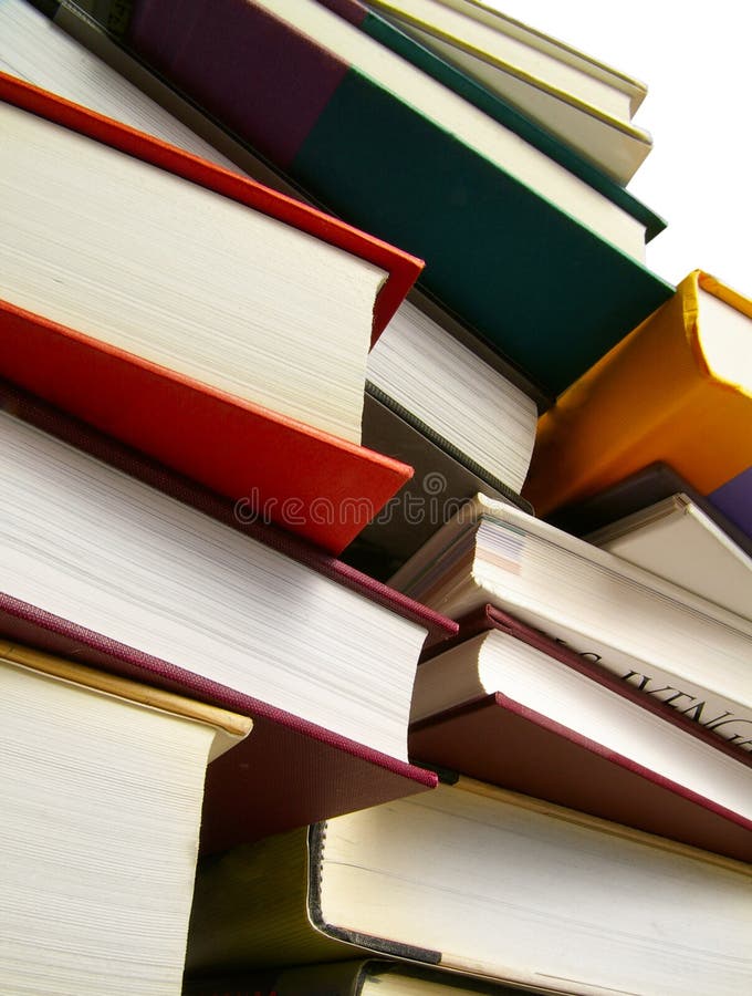 Various hardcover books stacked, isolated on white with clipping path. Various hardcover books stacked, isolated on white with clipping path