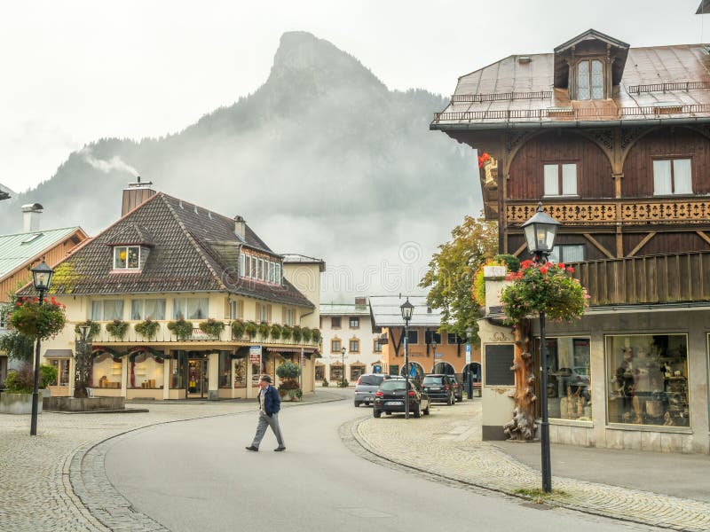 OBERAMMERGAU - OCTOBER 13 : City scenes and building paintings in Oberammergau, Germany, under misty morning sky, on October 13, 2016. OBERAMMERGAU - OCTOBER 13 : City scenes and building paintings in Oberammergau, Germany, under misty morning sky, on October 13, 2016.