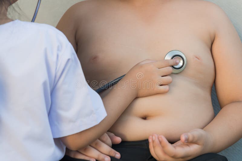 Obese asian boy check heart by stethoscope