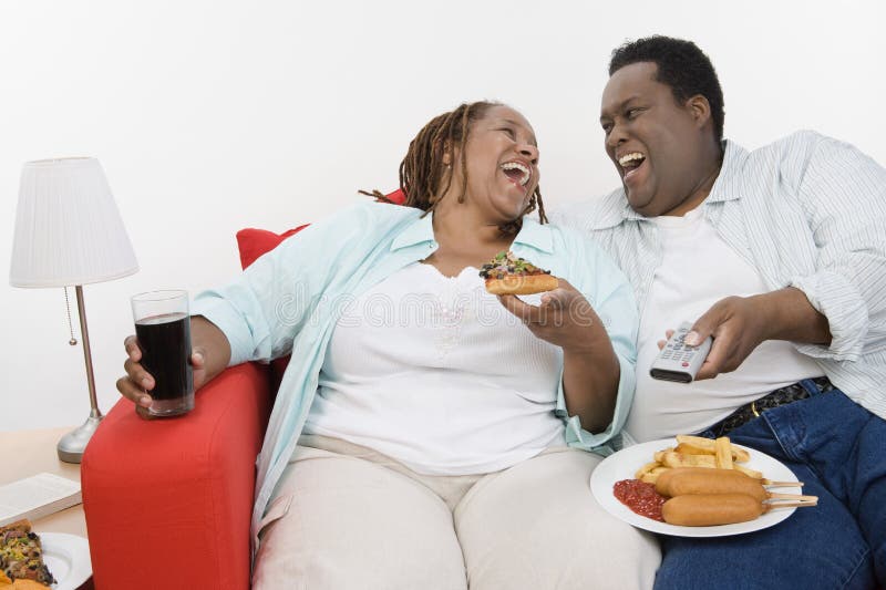 An Obese Couple Laughing Together.
