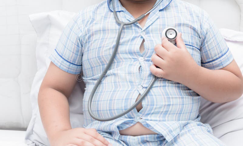 Obese fat boy check heart by stethoscope.