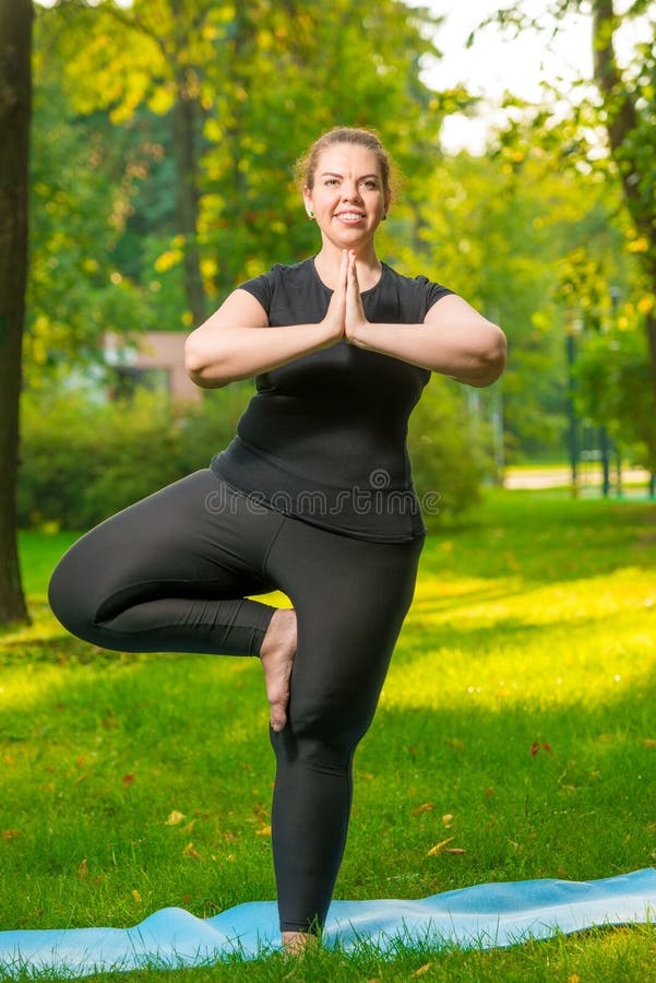 Fat Cheerful Woman Doing Yoga In The Park, Plus Size Model Stock Photo,  Picture and Royalty Free Image. Image 121509153.