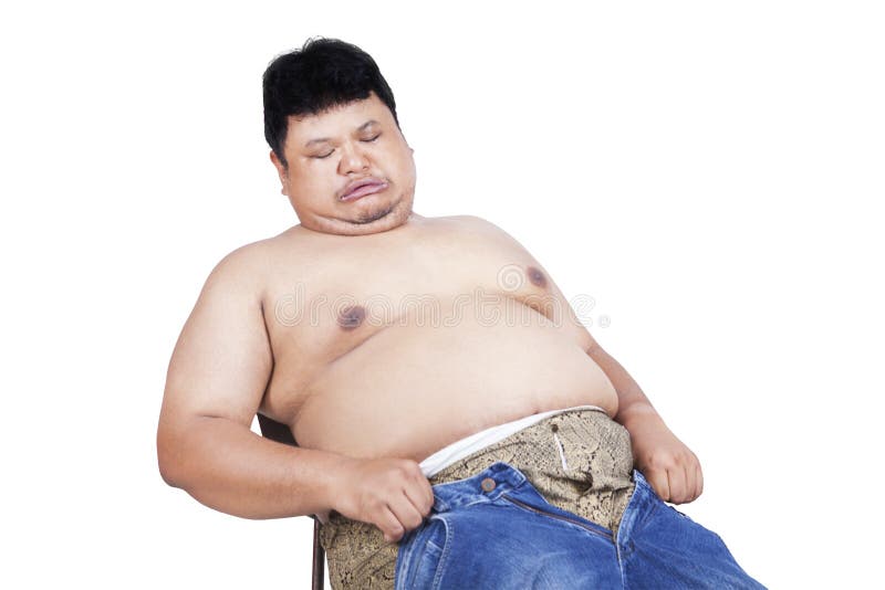 Obese man trying to wear his old jeans stock photos Obese man trying to wear his old jeans stock photos