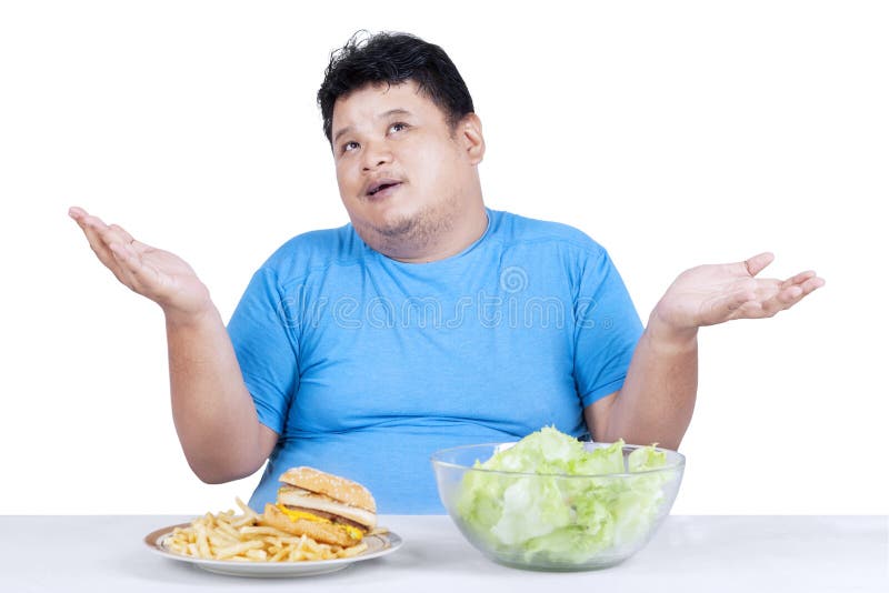 Obese man with two kinds of food 1 stock photography Obese man with two kinds of food 1 stock photography