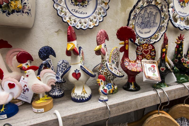 Obidos, Portugal, 15 June 2018: Souvenirs at a roadside stall in the old tourist town of Obidos. In Portugal royalty free stock photography Obidos, Portugal, 15 June 2018: Souvenirs at a roadside stall in the old tourist town of Obidos. In Portugal royalty free stock photography