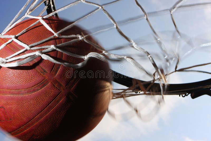 Picture of a basketball field goal with the sky in background. Picture of a basketball field goal with the sky in background.