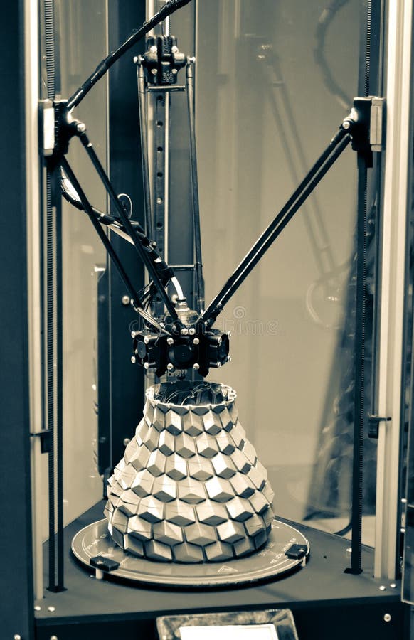 The object printed on the 3d printer stands on desktop of three-axis 3d printer stock photo