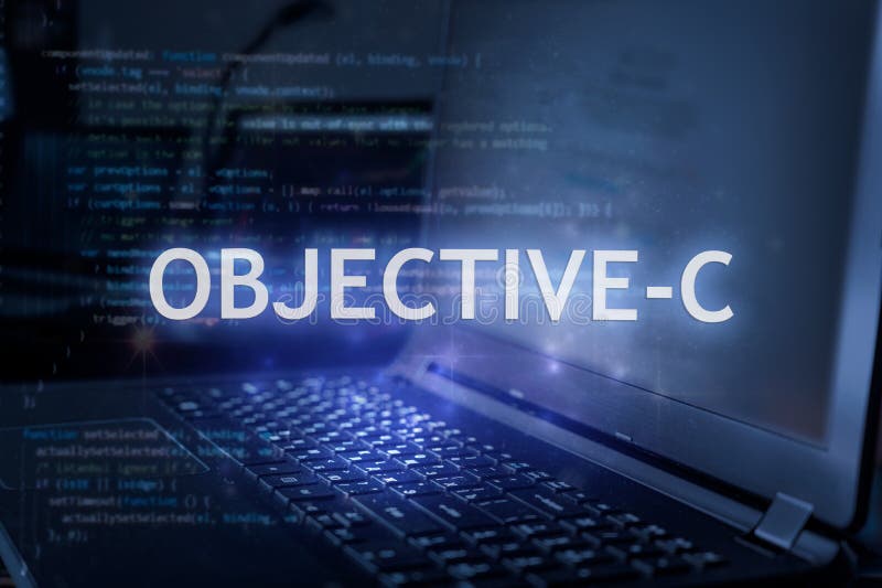 Objective-C inscription against laptop and code background. Learn programming language, computer courses, training stock image