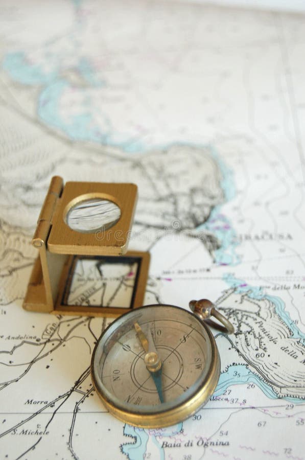 Old Lens and compass on a map !. Old Lens and compass on a map !