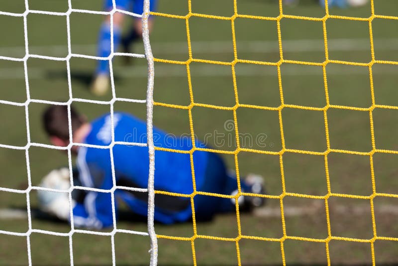 Objetivo na rede do futebol imagem de stock Objetivo na rede do futebol imagem de stock