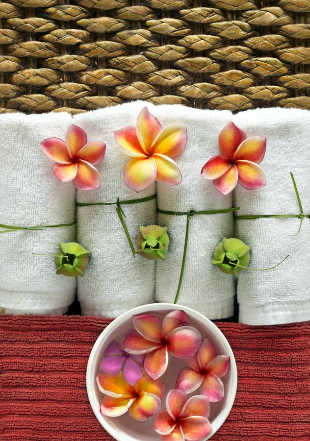 Spa objects with tropica flowers on natural texture. Spa objects with tropica flowers on natural texture