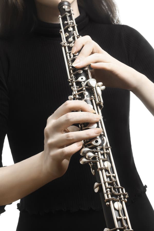 Oboe player hands playing musical instrument