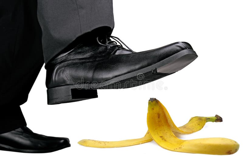 Businessman about to step on banana peel. Businessman about to step on banana peel