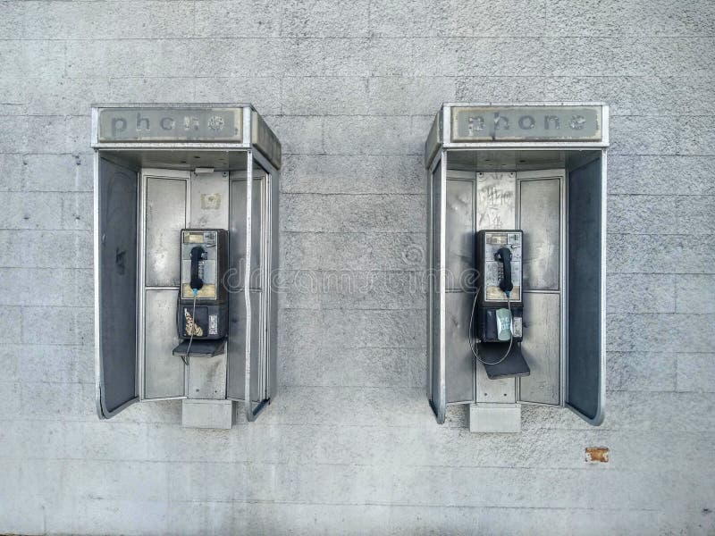 Obsolete vintage pay phones stock images