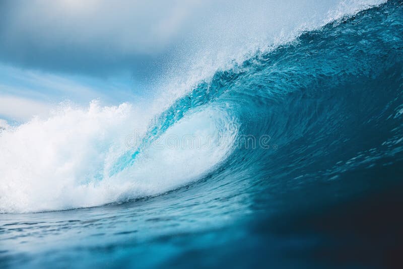 Ocean barrel wave in ocean. Breaking wave for surfing in Bali