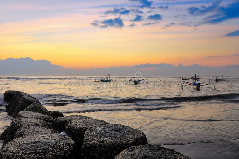 Ocean coast sunrise and katamarans