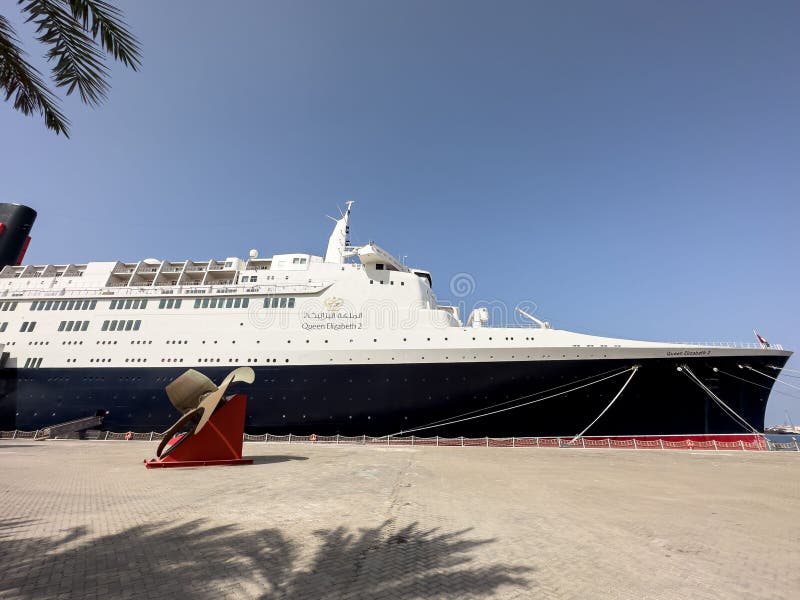 Ocean Liner Queen Elizabeth 2 Docked in the Harbor Against the Background of the Blue Sky