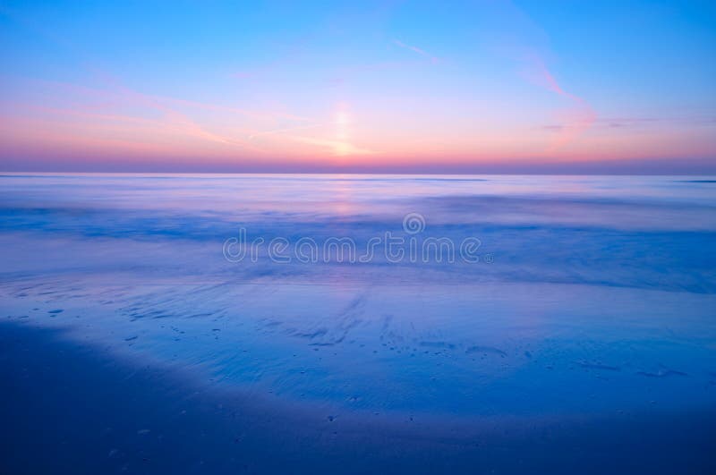 Ocean at night. Peaceful scene of the ocean at night (photo taken with a slow shutterspeed royalty free stock photo