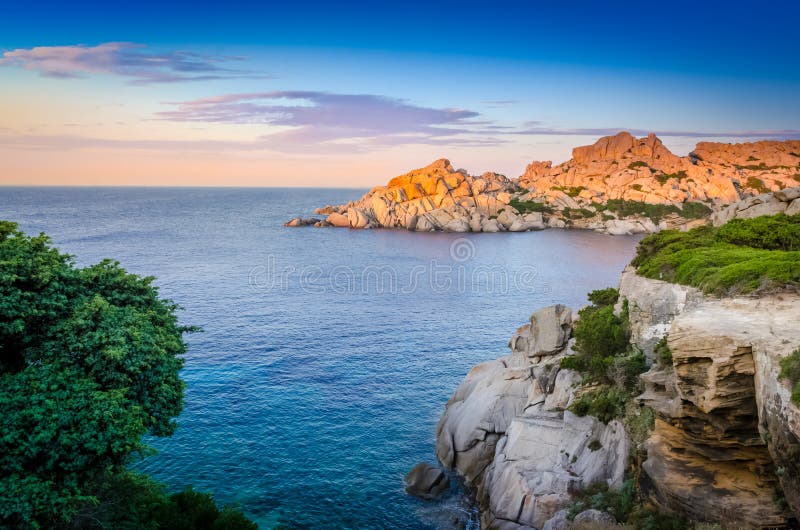 Ocean rocky coastline colorful sunset view, Sardinia