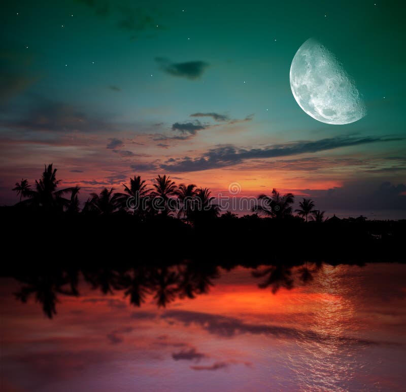 The ocean, sunset and moon