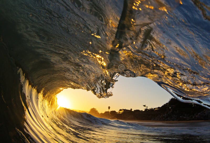 Ocean Wave Tube at Sunset on the Beach in California